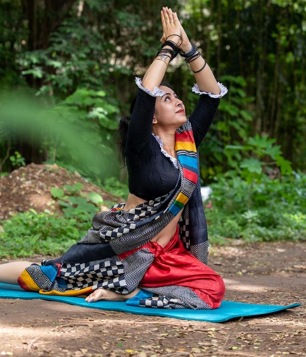 Woman practicing gentle morning yoga for body tone